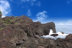Bei-guan Tidal Park . numerous types of terrain of marine abrasion , inxluding Chessboard Rock, One line sky and more. With waves crashing against the reeves,it forms various types of odd terrain.