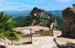 Picturesque view to spanish Xativa Castle or Castillo de Xativa ancient fortification of Spain during sunny summer day. Travel destinations, landmarks, touristic places concept. Spain, Europe