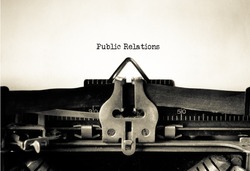 Public Relations word typed on a Vintage Typewriter. 