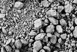 The black and white background image of the pile of dry soil