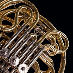 Fragment french horn closeup on a black background