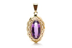 Antique gold pendant with an amethyst stone