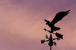 Eagle weather vane in a beautiful sky