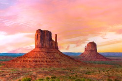 Beautiful sunset over the West and East Mitten Butte in Monument Valley. Utah, USA
