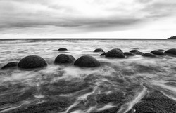 Moeraki Boulders on the Koekohe beach. Eastern coast of New Zealand. HDR image, black and white