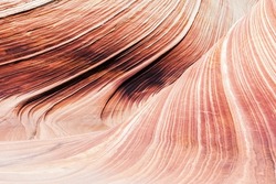 The Wave is an awesome vivid swirling petrified dune sandstone formation in Coyote Buttes North. Natural rock background