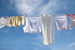 Laundry drying on the rope outside on a sunny day