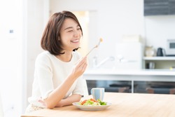 young attractive asian woman who eats