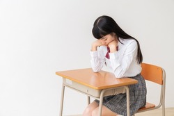 asian girl who study,think,School uniform,School classroom