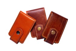 Set of three luxury craft business card holder cases made of leather. Brown Leather boxes for cards isolated on white background.