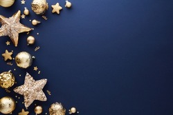 Luxury gold Christmas decorations on dark blue background. Xmas greeting card template, Happy New Year banner mockup.