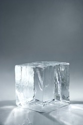 transparent big ice cube on neutral background