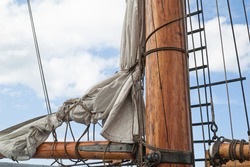 Old sailing ship masts and sails and rigging