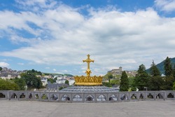 The Upper Basilica with gilded crown ad cross in Lourdes