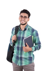 A young student carrying his backpack and books, isolated on a white background.