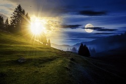 fir trees on meadow between hillsides with conifer forest in fog with sun and moon at twilight. day and night time change concept. mysterious countryside scenery in morning light
