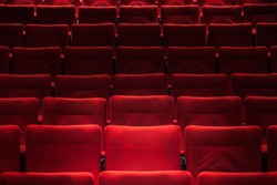 Red empty chairs in the theatre