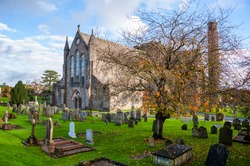 Kilkenny, Ireland. Cemetery in front of Cathedral Church of St Canices in Kilkenny, Ireland during the cloudy day
