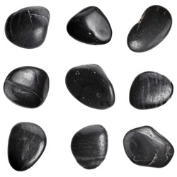 Collection of black SPA stones close up macro set isolated on white background