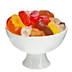 Colorful  gummy bear candies in a bowl isolated on white