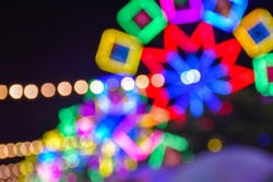 Night lights and bokeh  from the Ferris wheel amusement park 