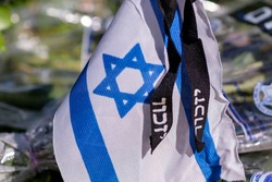 Memorial flag with Yizkor (In memory) word on a soldiers grave on Memorial Day for the Fallen Soldiers of Israel and Victims of Terrorism.