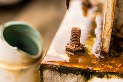 Rusty Nut and Bolt corrosive from acid rain water humidity destroying structure and strength.