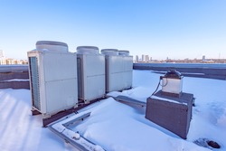 Air conditioning system assembled and installed on top of a building.