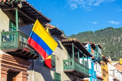 Colombian flag on a historic building in La Candelaria neighborhood in Bogota, Colombia