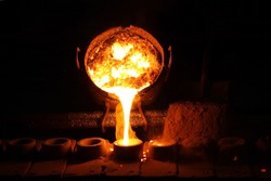 Foundry - molten metal poured from ladle