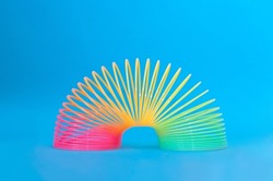 Toy plastic colorful rainbow spiral, antistress concept.