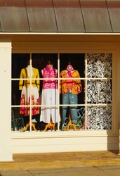 A shop window featuring a colorful fashion display