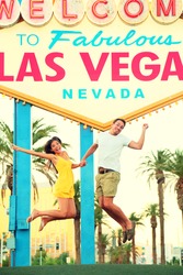 Las Vegas Sign. Happy people jumping having fun in front of Welcome to Fabulous Las Vegas sign. Beautiful young couple on the Strip cheerful and excited during travel holidays vacation, Nevada, USA.