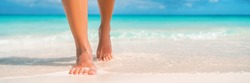 Woman feet walking on caribbean beach barefoot closeup of foot coming out of water after swim banner panorama. Honeymoon travel vacation,