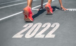 New Year 2022 ready set go fitness getting in shape woman runner at start line for goal achievement weight loss challenge banner.
