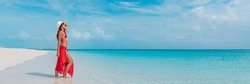 Luxury beach vacation elegant tourist woman walking relaxing in beachwear hat on white sand Caribbean beach. Lady tourist on holiday vacation resort. Banner panorama landscape