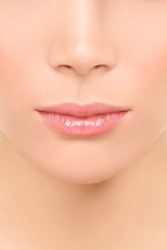 Mouth and nose closeup - beauty face woman. Beautiful lips closeup of mixed race Asian Caucasian beauty model.