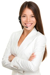 Telemarketing headset woman from call center smiling happy talking in hands free headset device. Multicultural mixed race Chinese Asian / Caucasian business woman in suit isolated on white background.