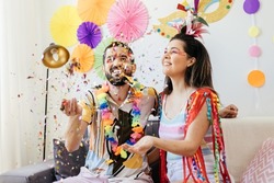 Brazilian Carnival. Couple celebrating carnival at home