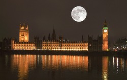 Night view with full moon of the Houses of Parliament Westminster Palace London