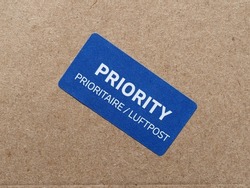 priority mail label tag on a small packet - luftpost translation airmail