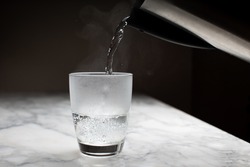 Pour hot water at night