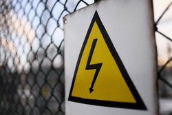 Generic High Voltage Danger Sign,symbol. Black arrow isolated in yellow triangle. Warning icon. 