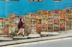 Girl walking in the colorful street in Hong Kong city