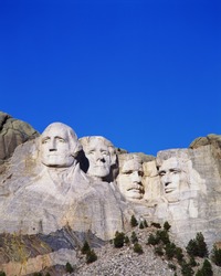 Mount Rushmore National Monument showing the faces of George Washington, Thomas Jefferson, Theodore Roosevelt, and Abraham Lincoln.