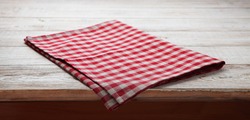 Napkin. Tablecloth tartan, checkered, dish towels on white wooden table background top view closeup