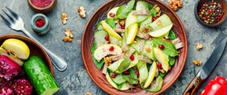 Delicious affordable salad of cucumber, spinach, apple and meat tongue.Healthy food.Spring salad