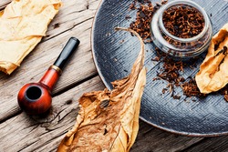 Vintage tobacco pipe, tobacco leaf and pipe tobacco