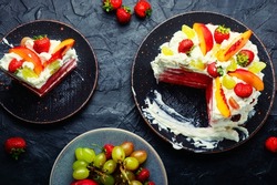 Symbolic summer watermelon pie with fruit and whipped cream.