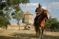  	Knight riding a horse in castle